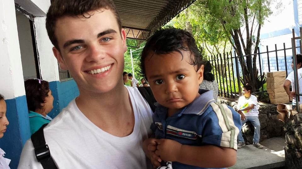 American Missionary holding toddler